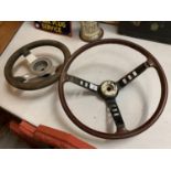 TWO VINTAGE STEERING WHEELS