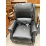 AN ELECTRIC RECLINING ARMCHAIR