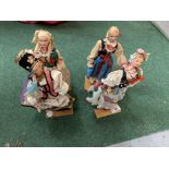 FOUR DOLLS ON WOODEN PLINTHS