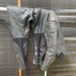 A SET OF TUZO MOTOR BIKE LEATHERS COMPRISING OF TROUSERS AND JACKET