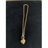 A SILVER T BAR NECKLACE