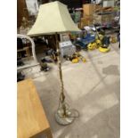 AN ONYX AND BRASS STANDARD LAMP