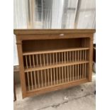 A WALL MOUNTED PINE PLATE RACK