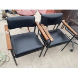 TWO TEAK AND LEATHERETTE ARMCHAIRS