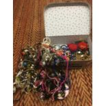 A VANITY CASE CONTAINING COSTUME JEWELLERY