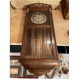 A VINTAGE WOODEN CASED WALL CLOCK