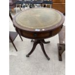 A MAHOGANY DRUM TABLE WITH GREEN LEATHER TOP