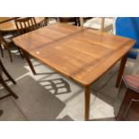 A DANISH TEAK DINING TABLE