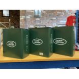 A SET OF THREE GRADUATED VINTAGE STYLE REPRODUCTION METAL LAND ROVER GREEN MOTOR OIL PETROL CANS