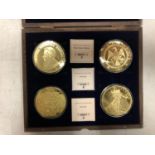 CASED SET OF FOUR GOLD PLATED COMM COINS