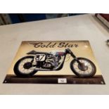 A GOLD STAR METAL ADVERTSING SIGN