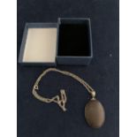 A BOXED SILVER AND WOOD NECKLACE