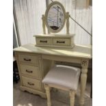 A PAINTED DRESSING TABLE WITH THREE LOWER AND TWO UPPER DRAWERS, OVAL BEVEL EDGE MIRROR AND DRESSING