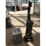 A MINI FRIDGE AND AN ORECK UPRIGHT HOOVER, BOTH IN WORKING ORDER