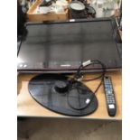 A SAMSUNG TV WITH REMOTE CONTROL (REQUIRES FIXING TO STAND) IN WORKING ORDER