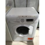 A HOTPOINT WMA0743 7 KG WASHING MACHINE, LIGHT CLEAN REQUIRED, WORKING ORDER