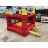 A BOUNCY CASTLE WITH ELECTRIC BLOWER (WORKING) 3 INCH TEAR TO SEAM BUT STILL INFLATES