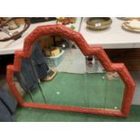 A LARGE RED FRAMED DECO STYLE MIRROR