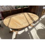 A PINE DINING TABLE
