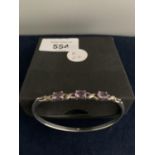 AN AMETHYST SILVER BANGLE