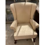 A PARKER KNOLL WING BACK ARMCHAIR