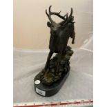 A BRONZE STAG ON MARBLE BASE, SIGNED