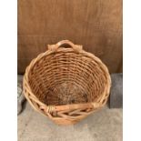 A LARGE WICKER LOG BASKET