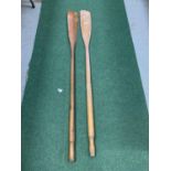 A VINTAGE PAIR OF WOODEN OARS