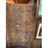 AN ORIENTAL RUG