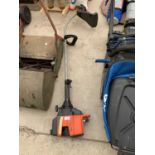 A FLYMO MAXI TRIM PETROL STRIMMER