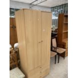 A PINE EFFECT WARDROBE WITH TWO DOORS AND THREE DRAWERS