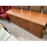 A TEAK SIDEBOARD WITH FOUR DOORS AND ONE DRAWER