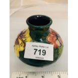 A MOORCROFT GREEN HIBISCUS VASE