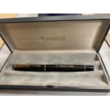 A CASED SHELL OILS PARKER FOUNTAIN PEN