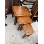 A ROSSMORE FURNITURE CHERRY WOOD NEST OF TABLES