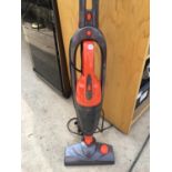 A GOODMANS 2 IN 1 VACUUM STICK CLEANER TOGETHER WITH A PRESTIGE MICROWAVE IN NEED OF A CLEAN