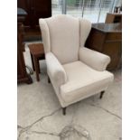 A WING BACK ARMCHAIR