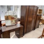 AN OAK THREE PIECE BEDROOM SUITE - A DRESSING TABLE, WARDROBE AND DRESSING CABINET