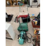 A PRESSURE WASHER AND A LAWN RAKER 30