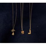 THREE SILVER NECKLACES WITH BELL, PIANO AND BIG BEN