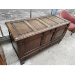 A VICTORIAN OAK BLANKET CHEST WITH INNER CANDLE BOX AND CONCEALED LOWER DRAWER, INLAID "ET 1691"