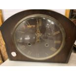 A WOODEN CASED MANTLE CLOCK