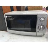 A SHARP MICROWAVE, SLIGHT RUSTING ON THE INSIDE, IN WORKING ORDER