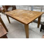 A RECTANGULAR OAK DINING TABLE