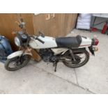 A 1978 HONDA CB 50 MOTORCYCLE, ONE OWNER FROM NEW 8,000 MILES AND KICKS OVER FREELY OWNERS MANUAL