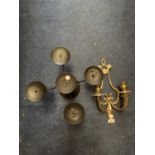 A BLACK FIVE CANDLE HOLDER AND A BRASS WALL TWO HOLDER EXAMPLE