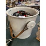 A VINTAGE WHITE CERAMIC BUCKET WITH A LARGE QUANTITY OF COSTUME JEWELLERY