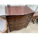A MAHOGANY SERPENTINE FRONT CHEST OF FOUR DRAWERS WITH UPPER DRESSING SLIDE