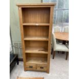 AN OAK FOUR TIER BOOKCASE WITH TWO LOWER DRAWERS