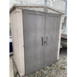A PLASTIC GARDEN STORE DOORS NEED RE HANGING